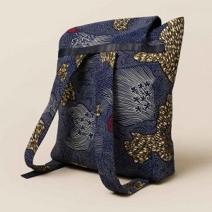 Side profile of a large African kitenge backpack with wide strap and structured base