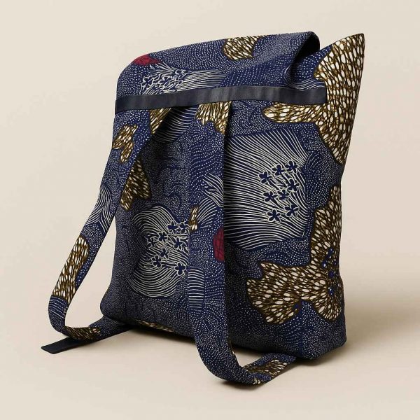 Side profile of a large African kitenge backpack with wide strap and structured base