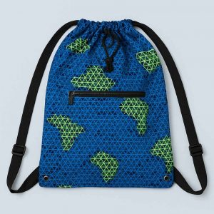 Handmade African Kitenge drawstring backpack laid flat with a Bible, notebook, pen, and keys to show capacity