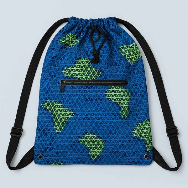 Handmade African Kitenge drawstring backpack laid flat with a Bible, notebook, pen, and keys to show capacity