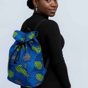 Beautiful Ugandan woman modeling a handmade African Kitenge drawstring backpack