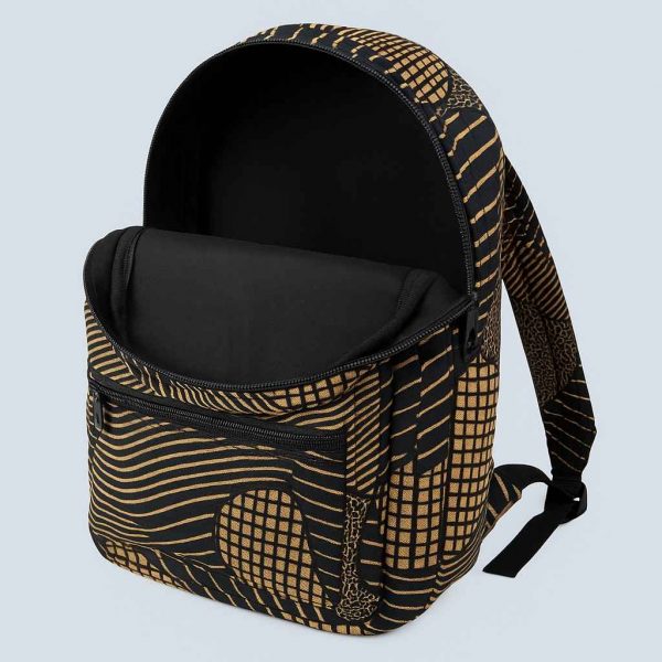 Interior studio view of an African Kitenge backpack showing the inner lining and compartments