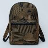 African print backpack with geometric patterns in brown and black, shown from the front view