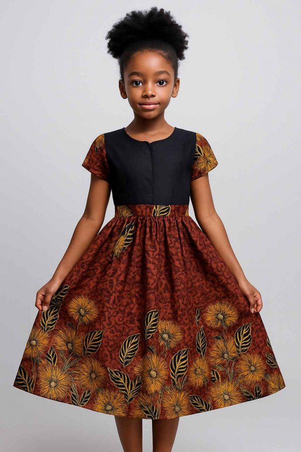 Front view of a girl’s flare dress in African kitenge, featuring short patterned sleeves and modest A-line silhouette