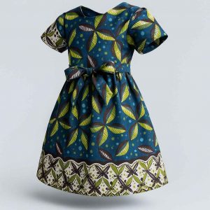 Angled view of handmade Kitenge girls’ dress with leaf print