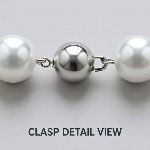 Detailed close-up of the clasp mechanism on a pearl-style beaded necklace from a handmade jewelry set