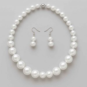 Studio image showing the bottom view of pearl-style necklace and earrings with gentle curve and central bead alignment