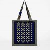 Back view of handmade checkerboard tote bag in black, white, blue, and mustard