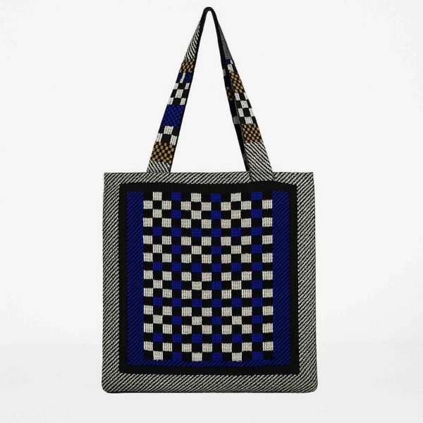 Back view of handmade checkerboard tote bag in black, white, blue, and mustard