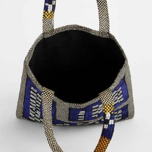 Interior view of woven checkerboard tote bag with open top and fabric lining
