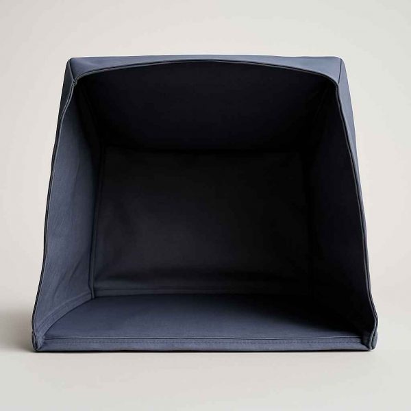 Studio view of the underside of a printer dust cover showing flat base and seam structure