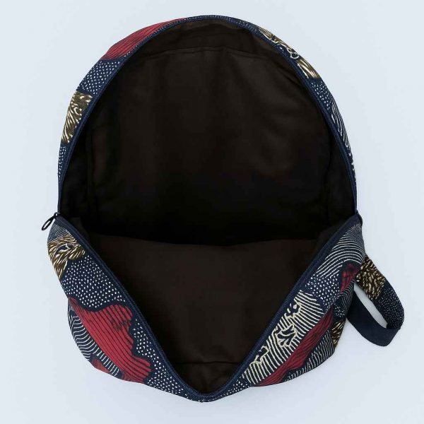 Interior view of an African Kitenge backpack, showing spacious brown fabric lining and reinforced stitching.