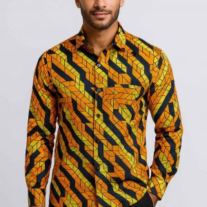 Handsome Ugandan man wearing African Kitenge men’s long-sleeve shirt studio view