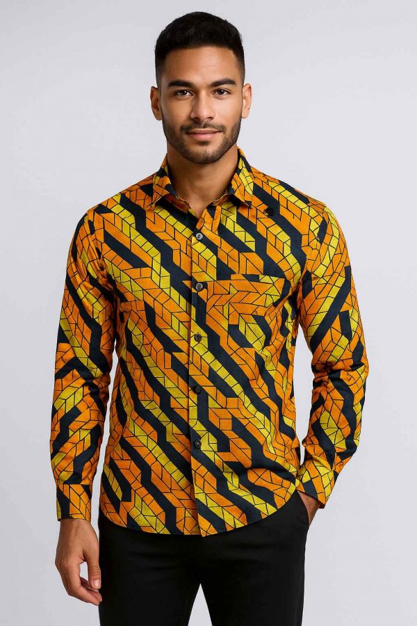 Handsome Ugandan man wearing African Kitenge men’s long-sleeve shirt studio view