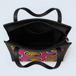 Top-down view of African Kitenge tote bag with pink yellow spiral print