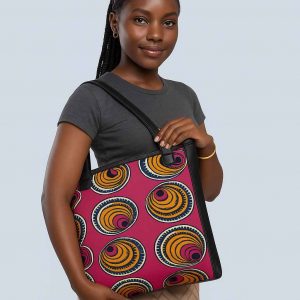 Ugandan woman carrying African Kitenge tote pink yellow spiral pattern