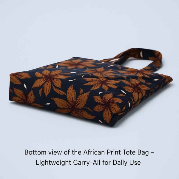 Underside studio view of a handmade African print tote bag showing flat base and fabric detail