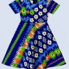Close-up of the lower half of a kitenge girl's dress showing vivid geometric and floral prints