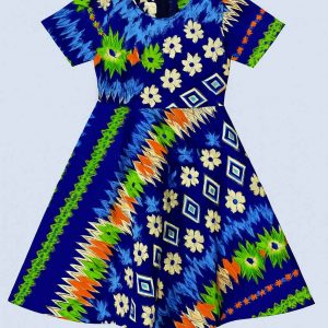 Close-up of the lower half of a kitenge girl's dress showing vivid geometric and floral prints