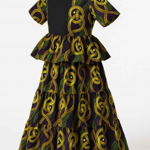 Angled view of a girls’ African kitenge dress with peplum waist, tiered skirt, and short sleeves in vibrant yellow, green, and purple fabric