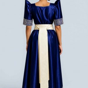 Elegant Ugandan woman wearing blue Gomesi with white sash back view