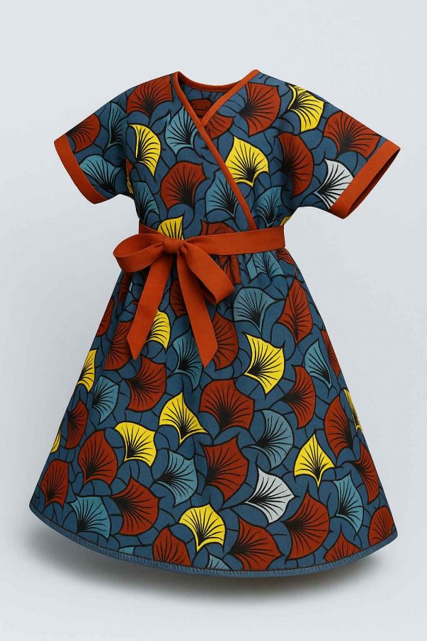 Angled view of handmade Kitenge girls’ dress