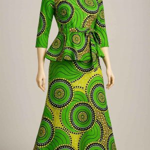 Angled studio view of green kitenge peplum dress