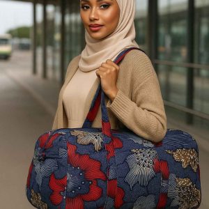 Glamorous African woman carrying handmade kitenge duffle bag