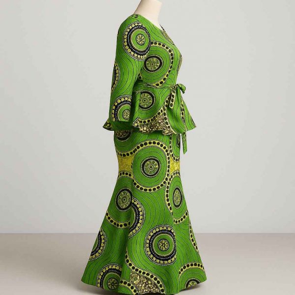 Side studio view of green kitenge peplum dress