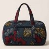 Side view of handmade African kitenge duffle bag