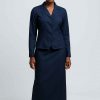 Front view of a modest navy blue two-piece office outfit worn by an elegant African woman