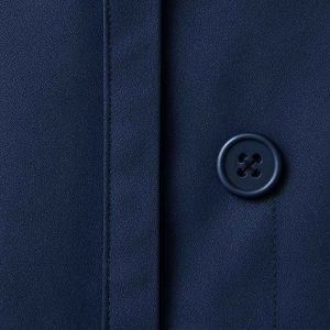 Top-down view of a navy blue two-piece office outfit laid flat on a pale background