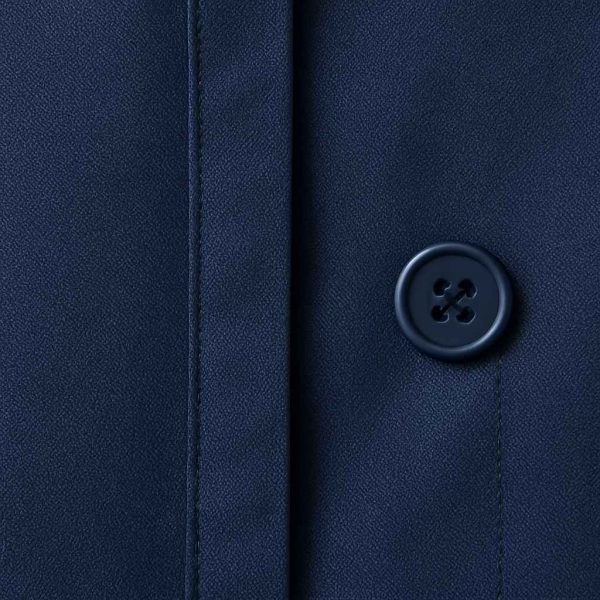 Top-down view of a navy blue two-piece office outfit laid flat on a pale background