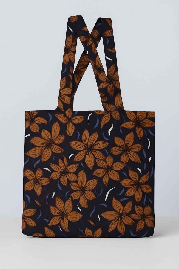 Front studio view of a handmade African print tote bag featuring orange floral design on dark background