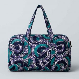 Back studio view of an African print duffle travel bag with visible stitching
