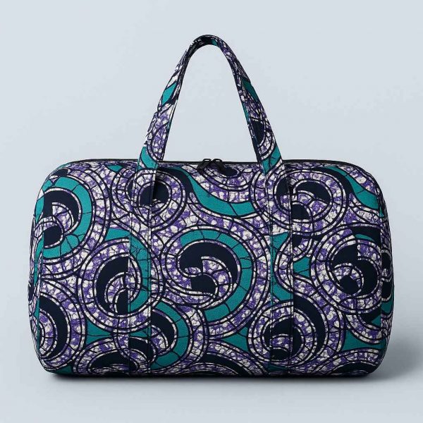 Studio image of a multipurpose African print travel bag front-facing on soft background
