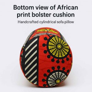 Underside studio view of a cylindrical African print bolster cushion showing base structure and pattern alignment