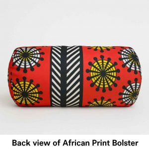 Rear studio view of a handmade African print bolster cushion showing fabric pattern and zipper placement