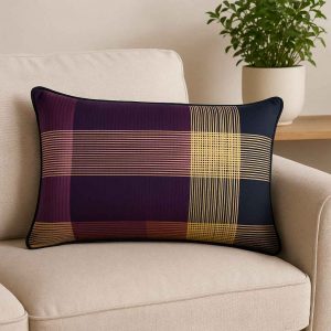 Striped decorative pillow placed on a neutral-toned couch in a cozy living room