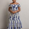 Lifestyle portrait of a young African girl in a floral Royal Bloom Dress