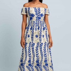 Lifestyle portrait of a young African girl wearing the Royal Bloom Dress