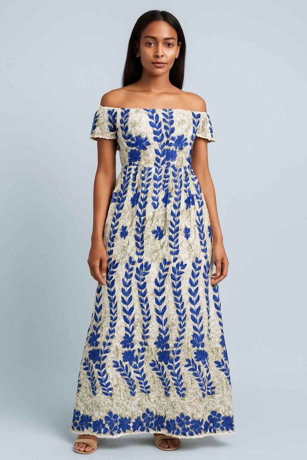 Lifestyle portrait of a young African girl wearing the Royal Bloom Dress
