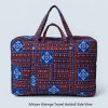 Handmade African Kitenge travel holdall shown from the back with traditional blue, red, and white pattern