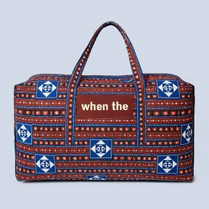 Handmade African Kitenge travel holdall shown from the front with traditional blue, red, and white pattern
