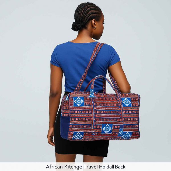 Beautiful Ugandan woman modeling a handmade African Kitenge travel holdall with traditional blue, red, and white patterns