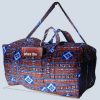 GraceTrail Kitenge Travel Holdall front view in blue, brick-red, and white African print handmade in Uganda