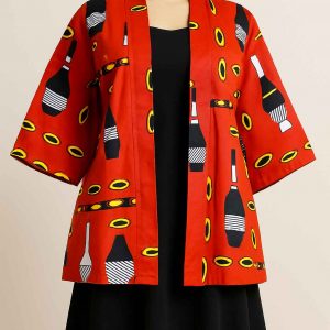 Front view of a mannequin dressed in a red African print jacket with medium sleeves, styled over a dark modest skirt.