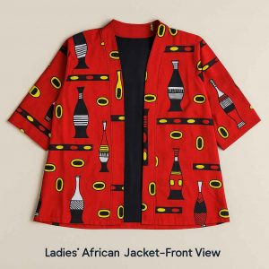Top-down view of a red African kitenge ladies’ jacket with medium sleeves, neatly arranged and styled with a dark skirt on a flat studio surface.