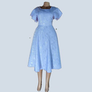 Front view of lavender modest midi dress with flutter sleeves and floral shimmer, handmade in Uganda.