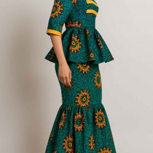 Side view of a women’s African one-step peplum dress with structured bodice, peplum waist, and mermaid skirt in green and orange print